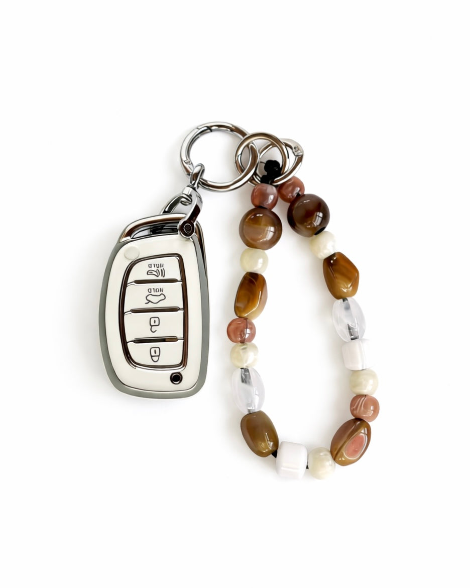 White Hyundai car key fob cover case with Bohemian and minimalism style agate color beaded wrist strap key chain, displayed on a white background.