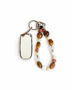 White Jeep car key fob cover case with Bohemian and minimalism style agate color beaded wrist strap key chain, displayed on a white background.