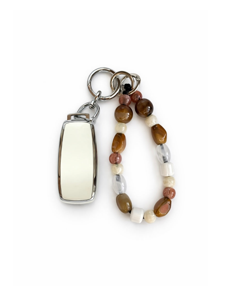 White Mercedes Benz car key fob cover case with Bohemian and minimalism style agate color beaded wrist strap key chain, displayed on a white background.
