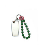 White Ford car key fob cover case, paired with a green beaded on pink wrist strap key chain, displayed on a white background.