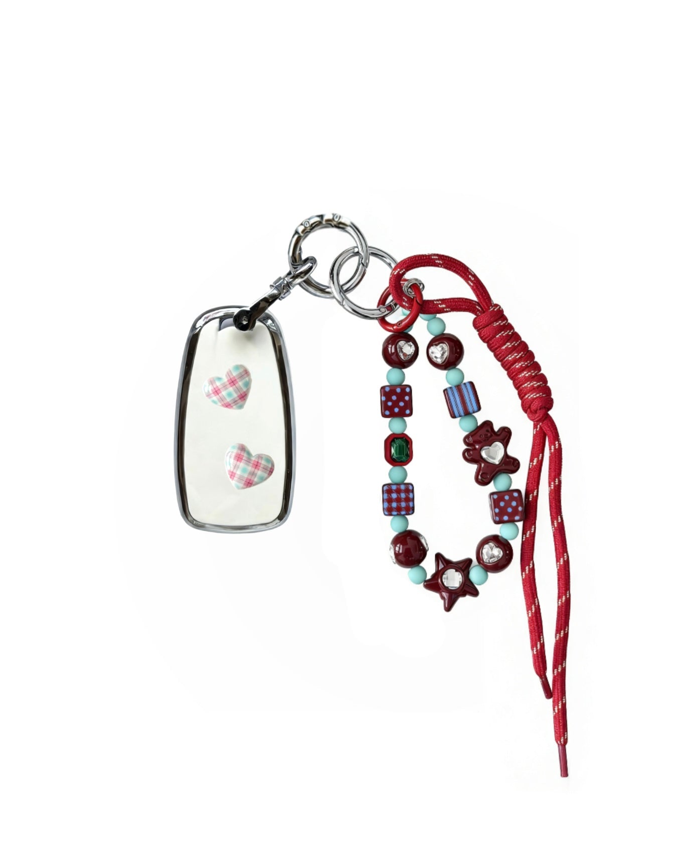 White Chevrolet car key fob cover case with pastel plaid heart design, paired with a handmade beaded keychain featuring cute patterned beads, and a red braided cord on a white background.