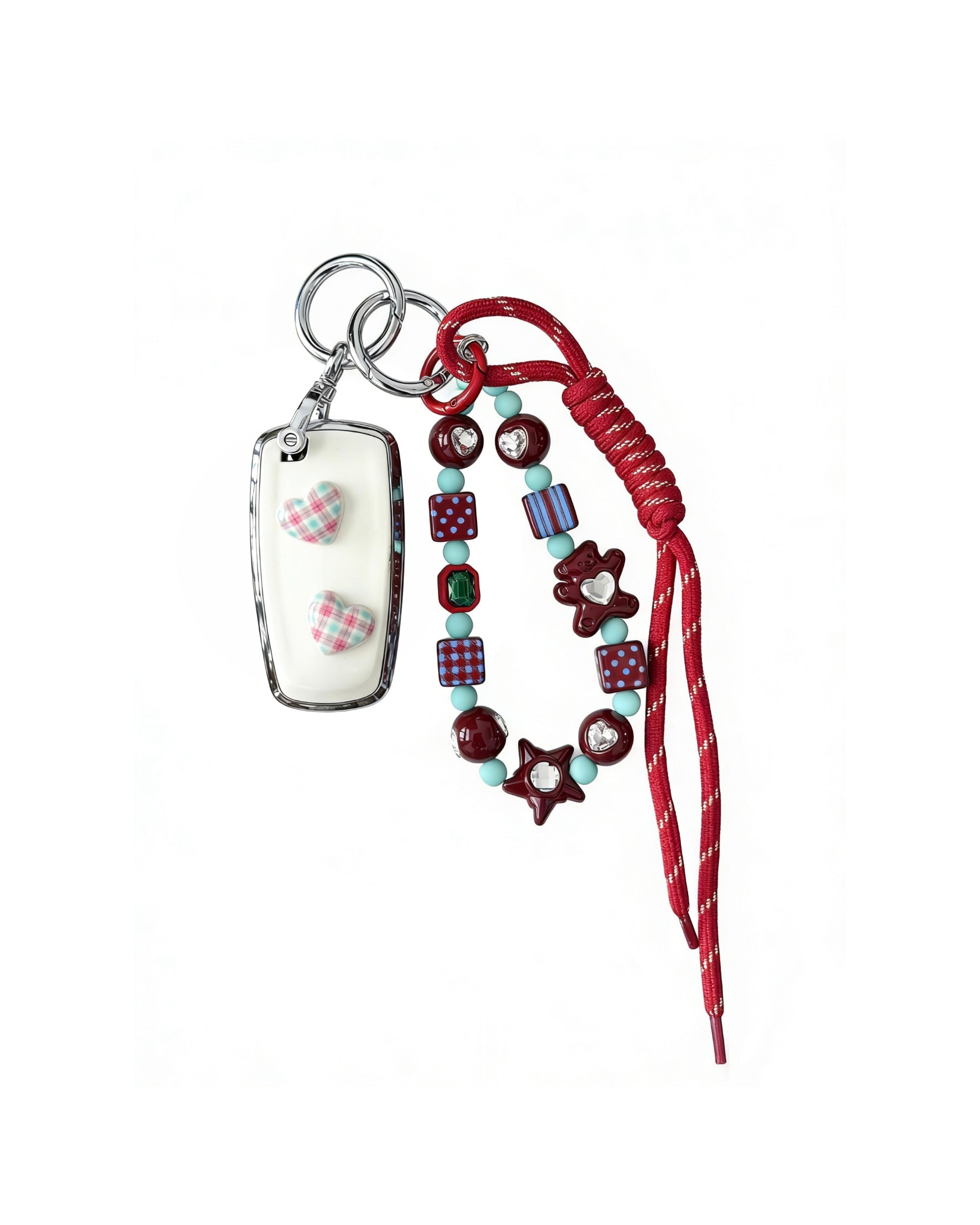 White Ford car key fob cover case with pastel plaid heart design, paired with a handmade beaded keychain featuring cute patterned beads, and a red braided cord on a white background.