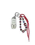 White Ford car key fob cover case with pastel plaid heart design, paired with a handmade beaded keychain featuring cute patterned beads, and a red braided cord on a white background.