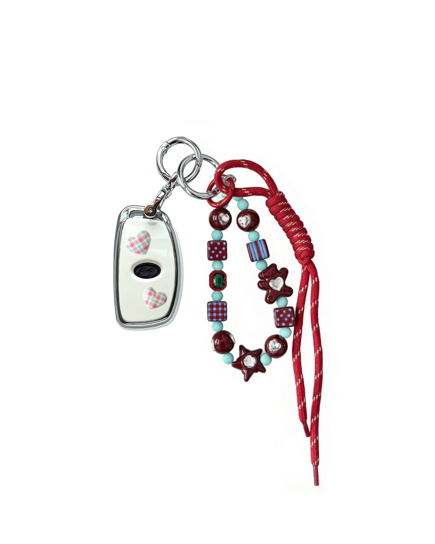 White Hyundai key fob case with pastel plaid heart design, paired with a handmade beaded keychain featuring cute patterned beads, and a red braided cord on a white background.