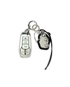 White Ford key fob case with black mirror and silver bow keychain