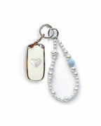 White Jeep key fob cover case with a pearl heart on the back, paired with a pearl white beaded wrist strap key chain featuring a blue accent bead and star charm, displayed on a white background.